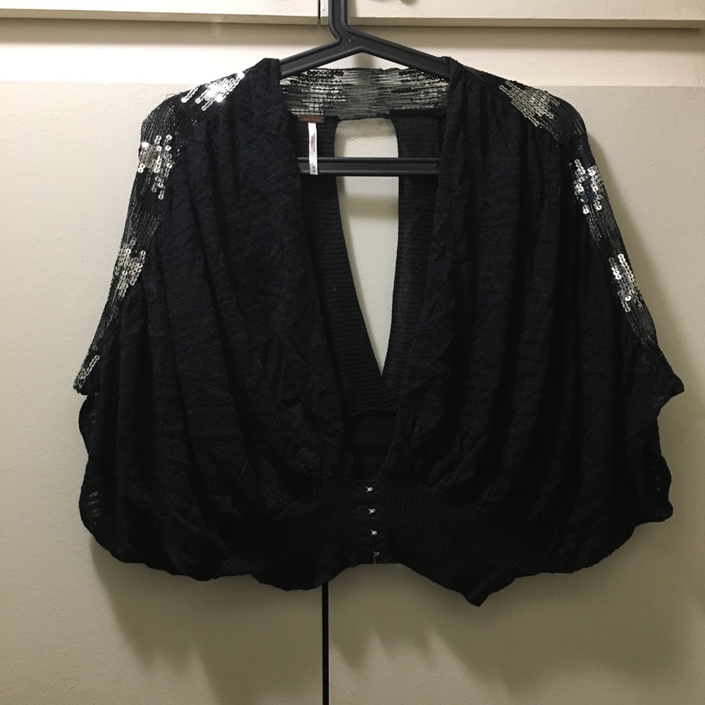 Black shrug with sliver sequences